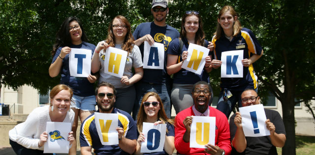 Students with thank you sign